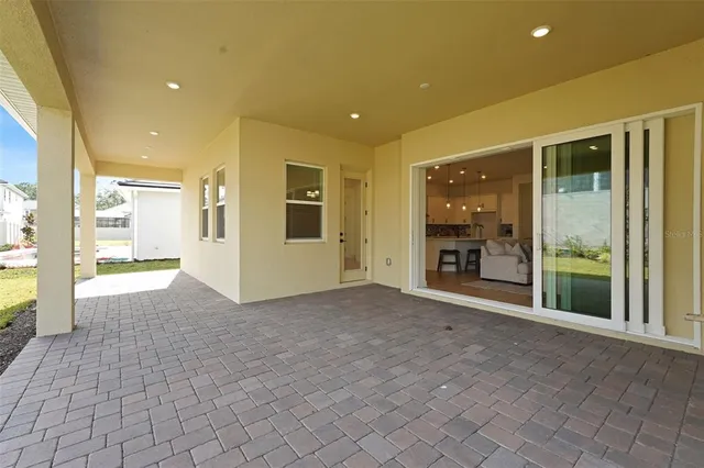 a view of a house with a garden and porch