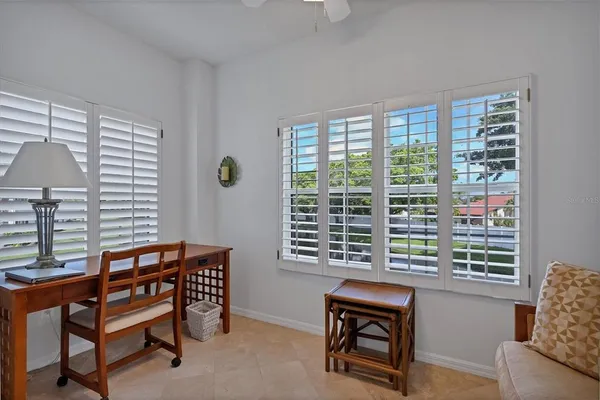 a view of a livingroom with furniture and a window