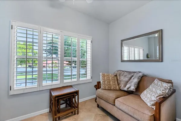a living room with furniture and a window