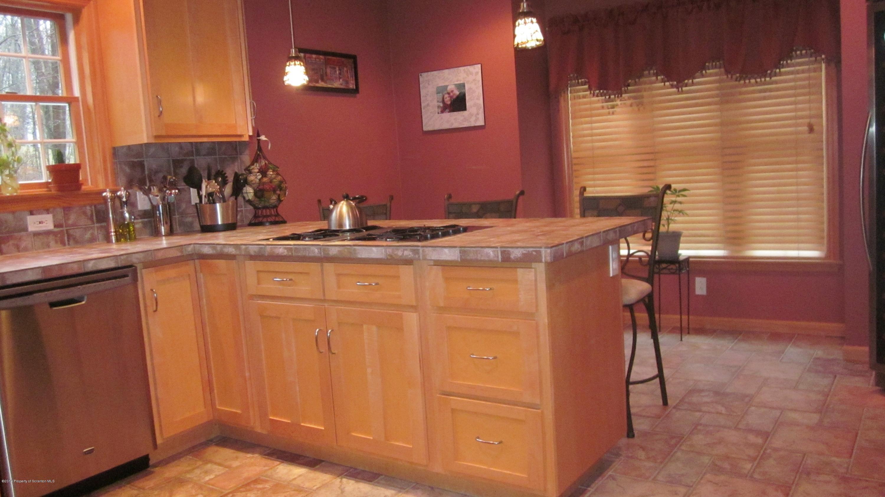 329 Golf Club Road Moscow, PA 18444 - Photo 3 of 56 a bathroom with a granite countertop sink and a mirror