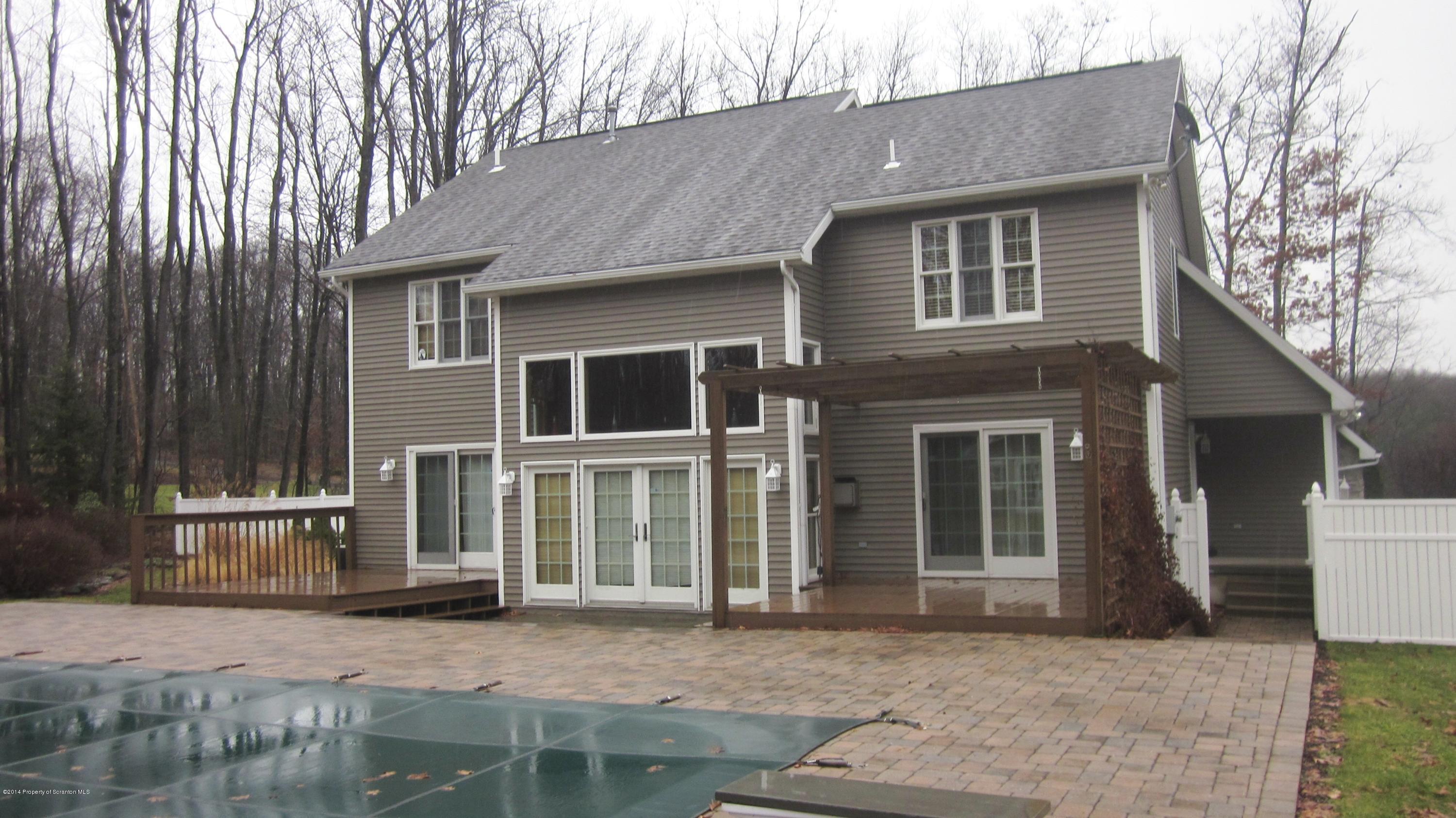 329 Golf Club Road Moscow, PA 18444 - Photo 32 of 56 a front view of a house with a garden
