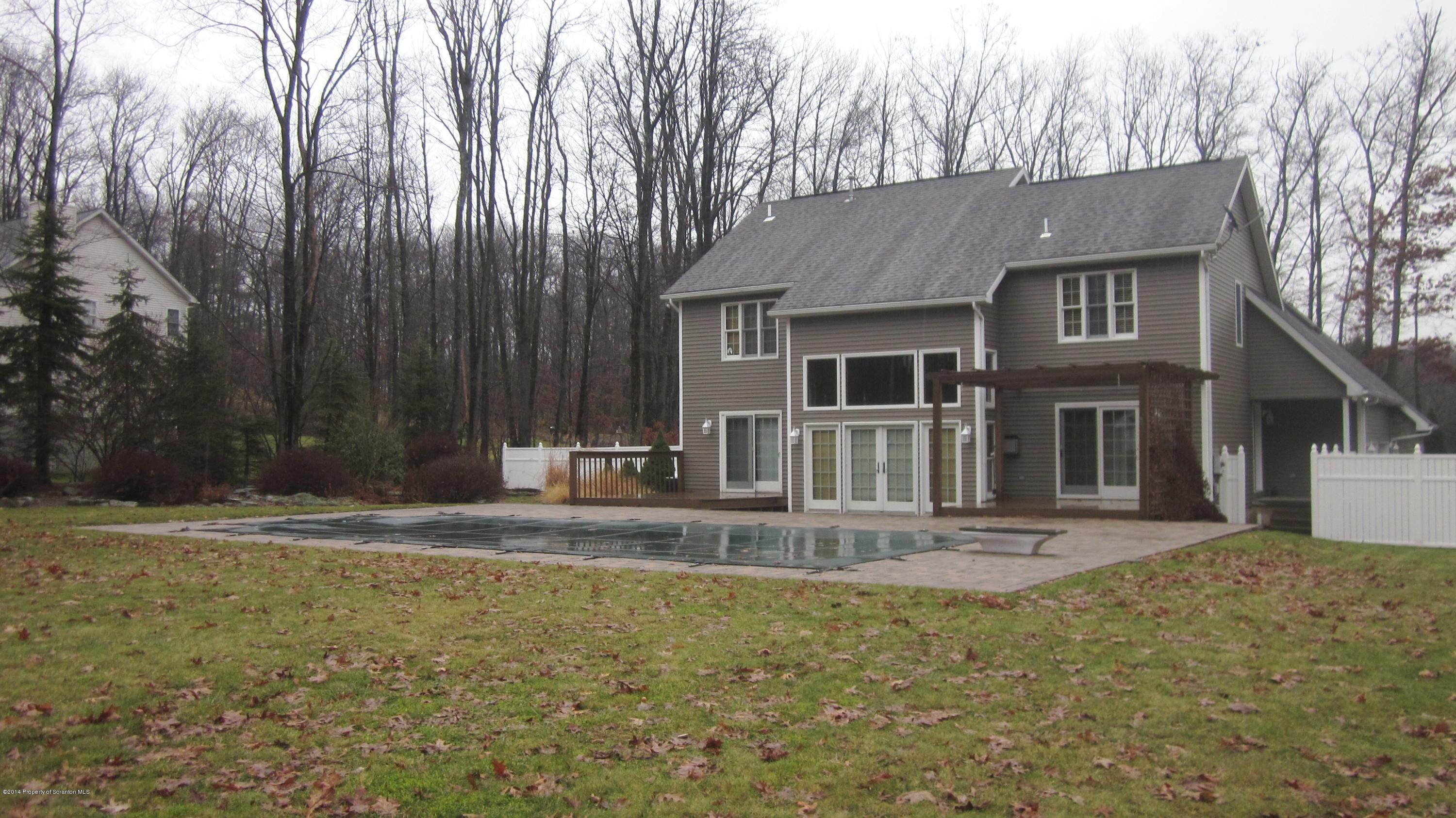 329 Golf Club Road Moscow, PA 18444 - Photo 35 of 56 a front view of a house with a yard