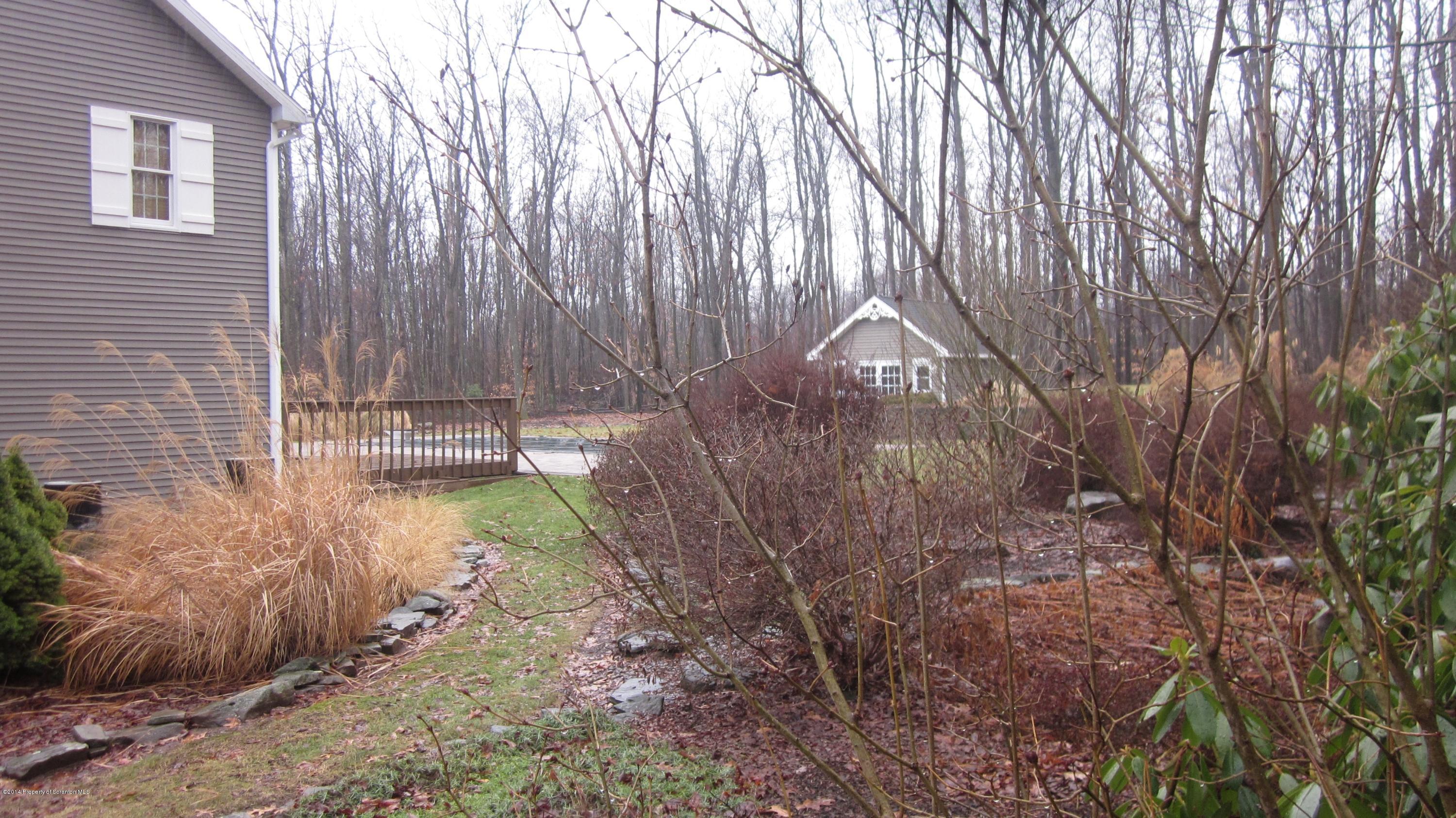 329 Golf Club Road Moscow, PA 18444 - Photo 54 of 56 a backyard of a house with a yard and outdoor seating