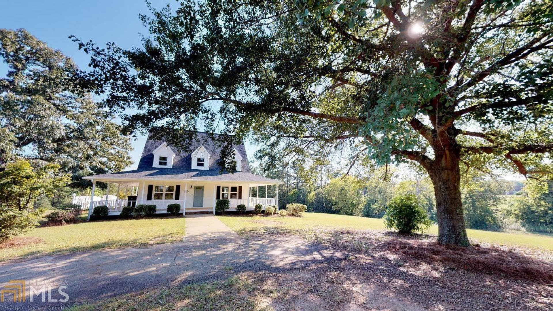 1084 Kay Road Byron, GA 31008 - Photo 1 of 1 a front view of a building with trees