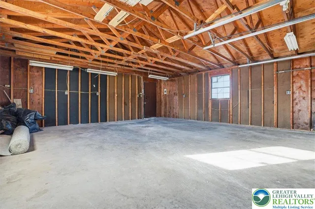 a view of a room with wooden walls