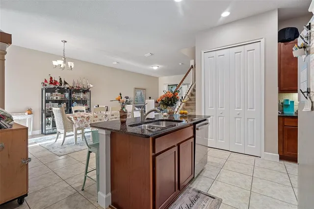 a kitchen with stainless steel appliances granite countertop a stove and a refrigerator