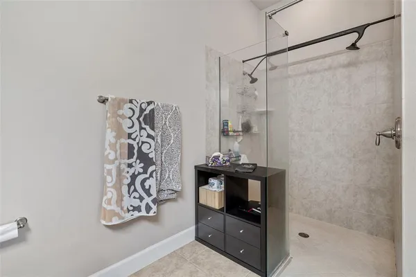 a bathroom with a shower toilet and sink