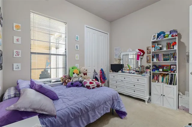 a bed room with bed and a window