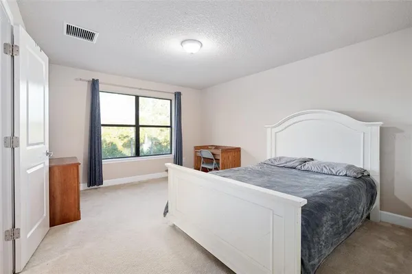 a room with a bed and a window