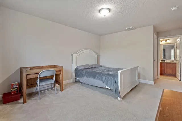 a living room with furniture and a dresser