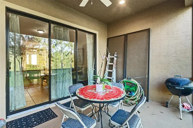 a view of a backyard with furniture and garden