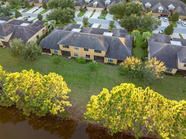 an aerial view of houses with outdoor space