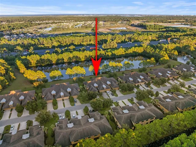 an aerial view of residential house with outdoor space