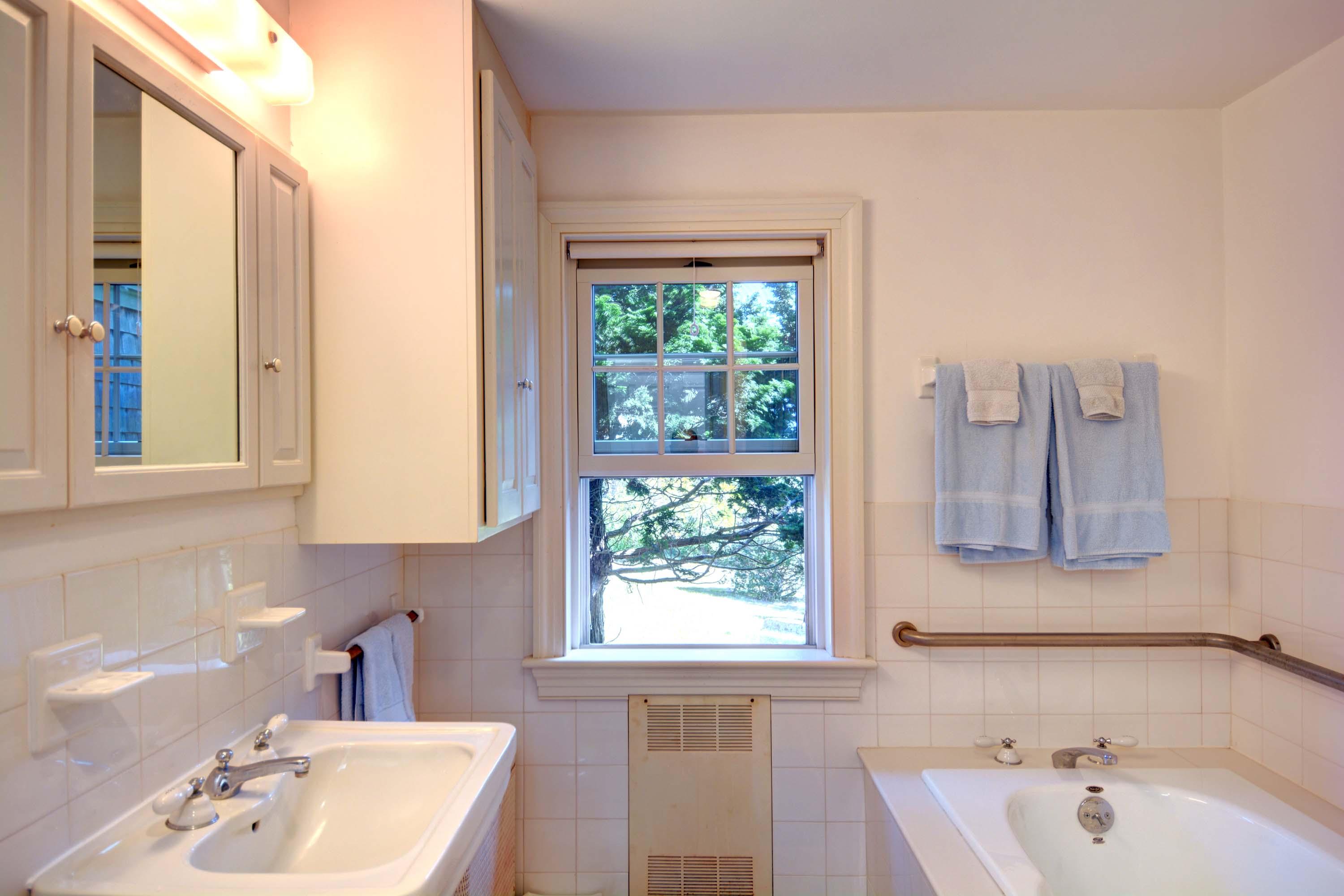 17 High Mark Road Chilmark, MA 02535 - Photo 20 of 52 a bathroom with a tub a sink and a window