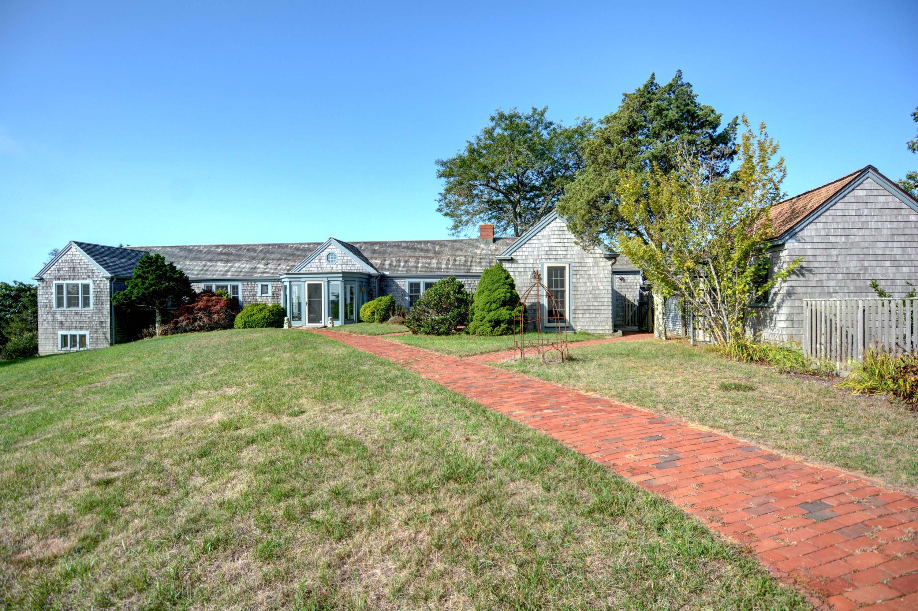 17 High Mark Road Chilmark, MA 02535 - Photo 2 of 52 a front view of house with yard and green space