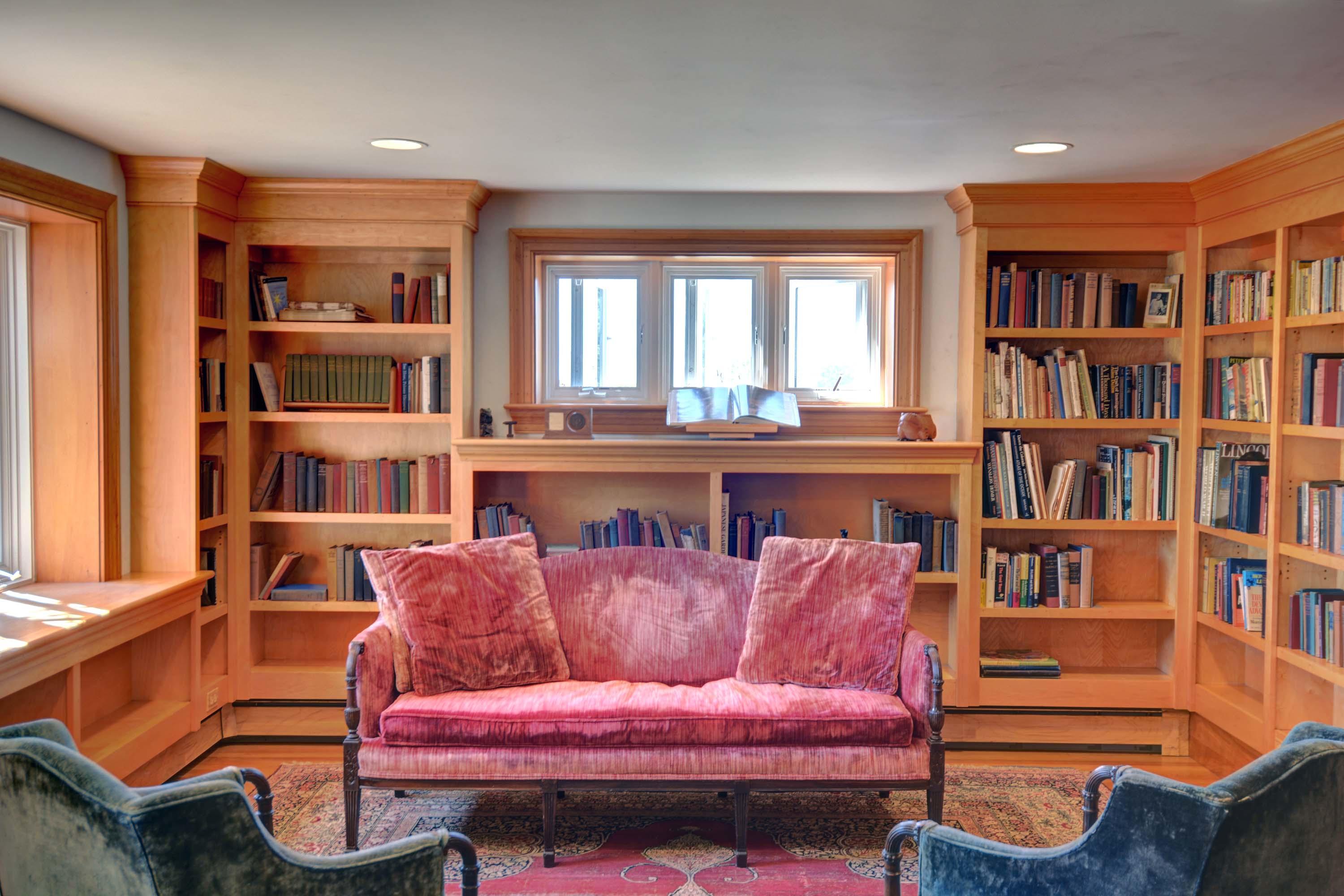 17 High Mark Road Chilmark, MA 02535 - Photo 26 of 52 a living room with furniture and a book shelf