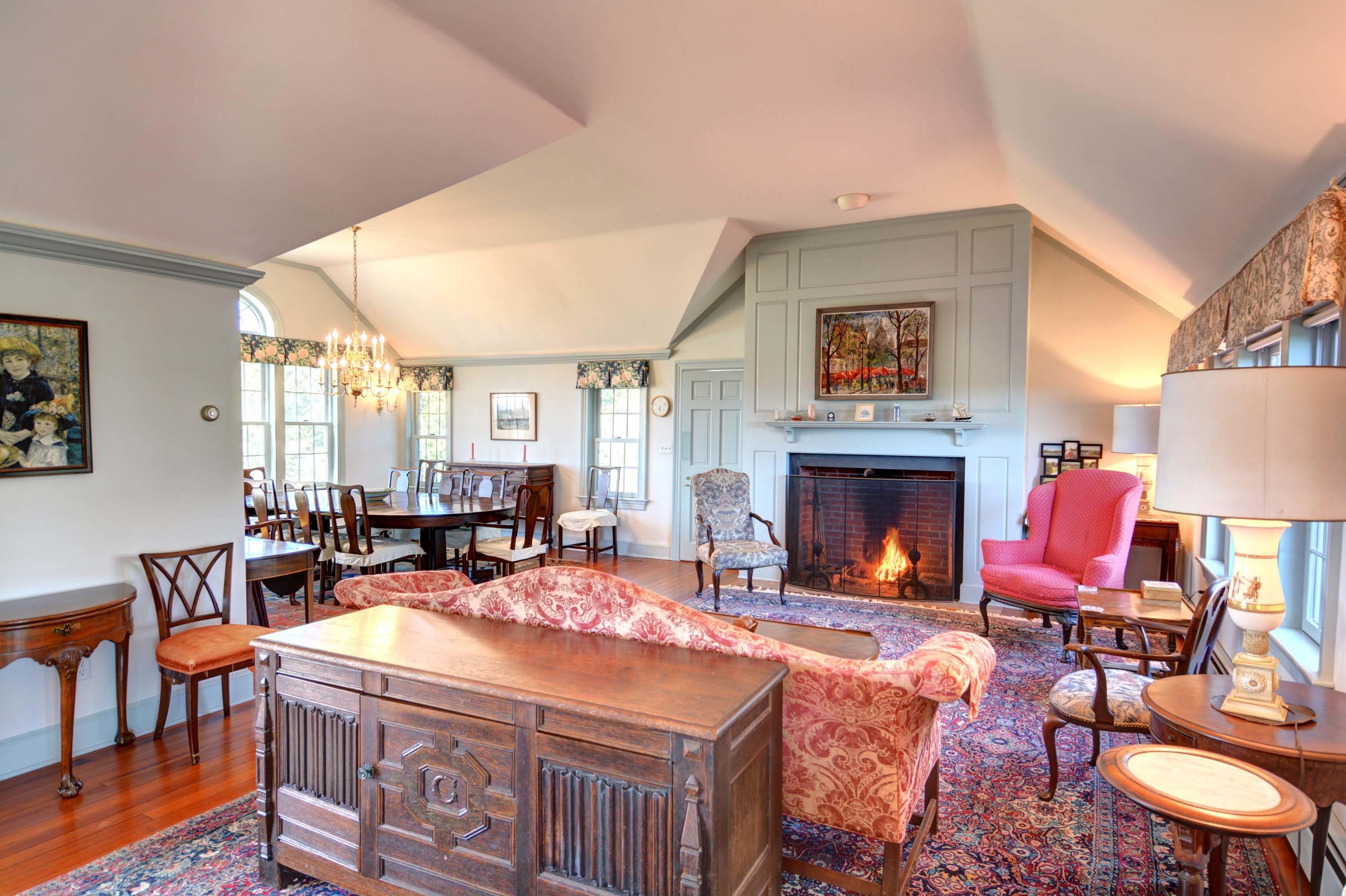 17 High Mark Road Chilmark, MA 02535 - Photo 3 of 52 a living room with furniture a fireplace and a large window
