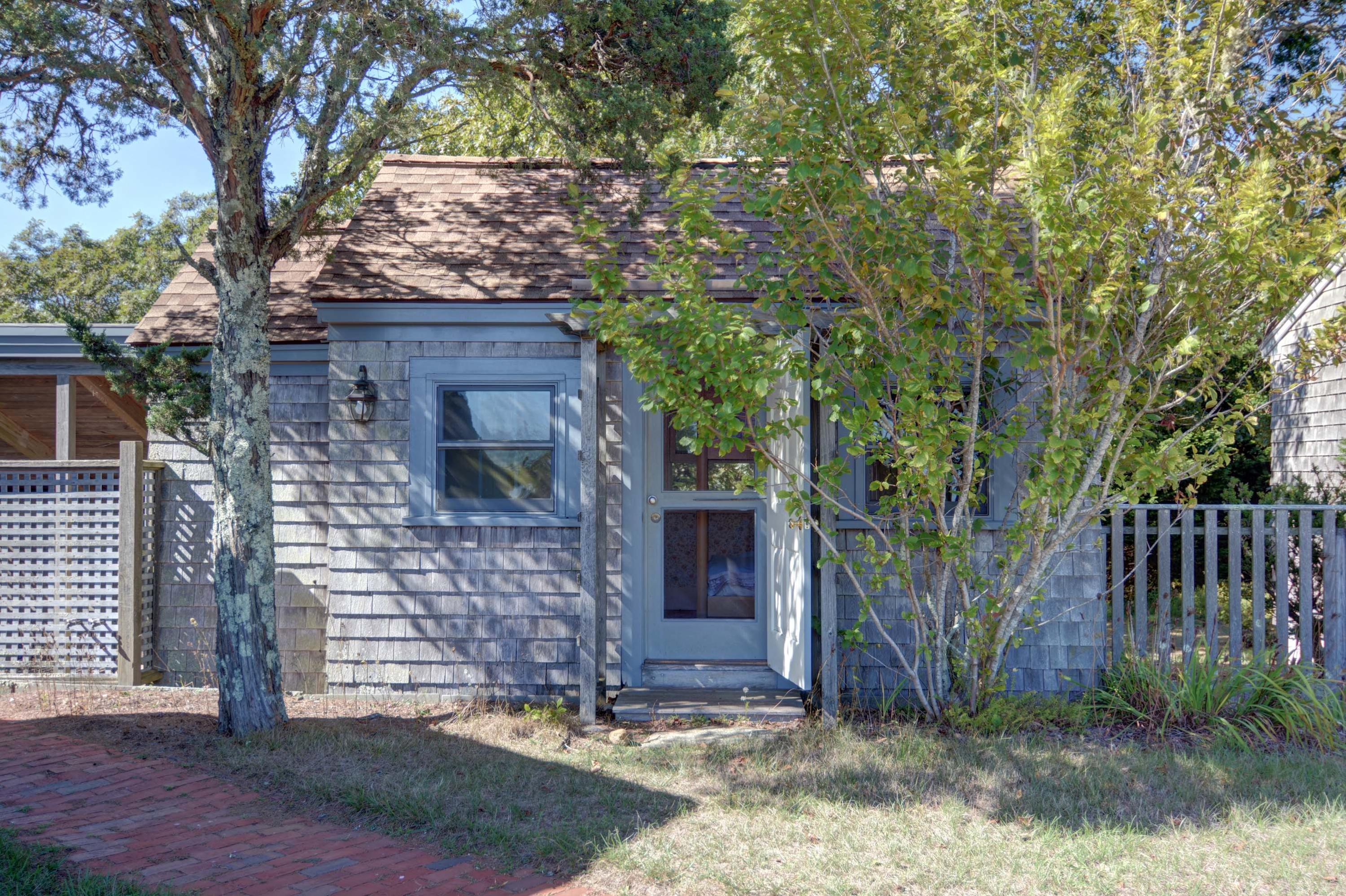 17 High Mark Road Chilmark, MA 02535 - Photo 34 of 52 a brick building with a tree in front of it