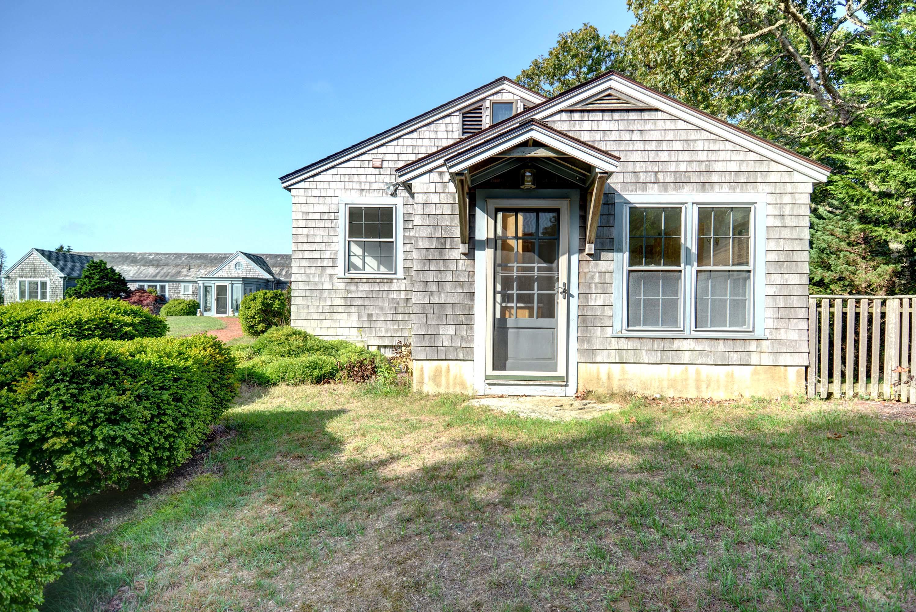 17 High Mark Road Chilmark, MA 02535 - Photo 38 of 52 a front view of a house with a yard