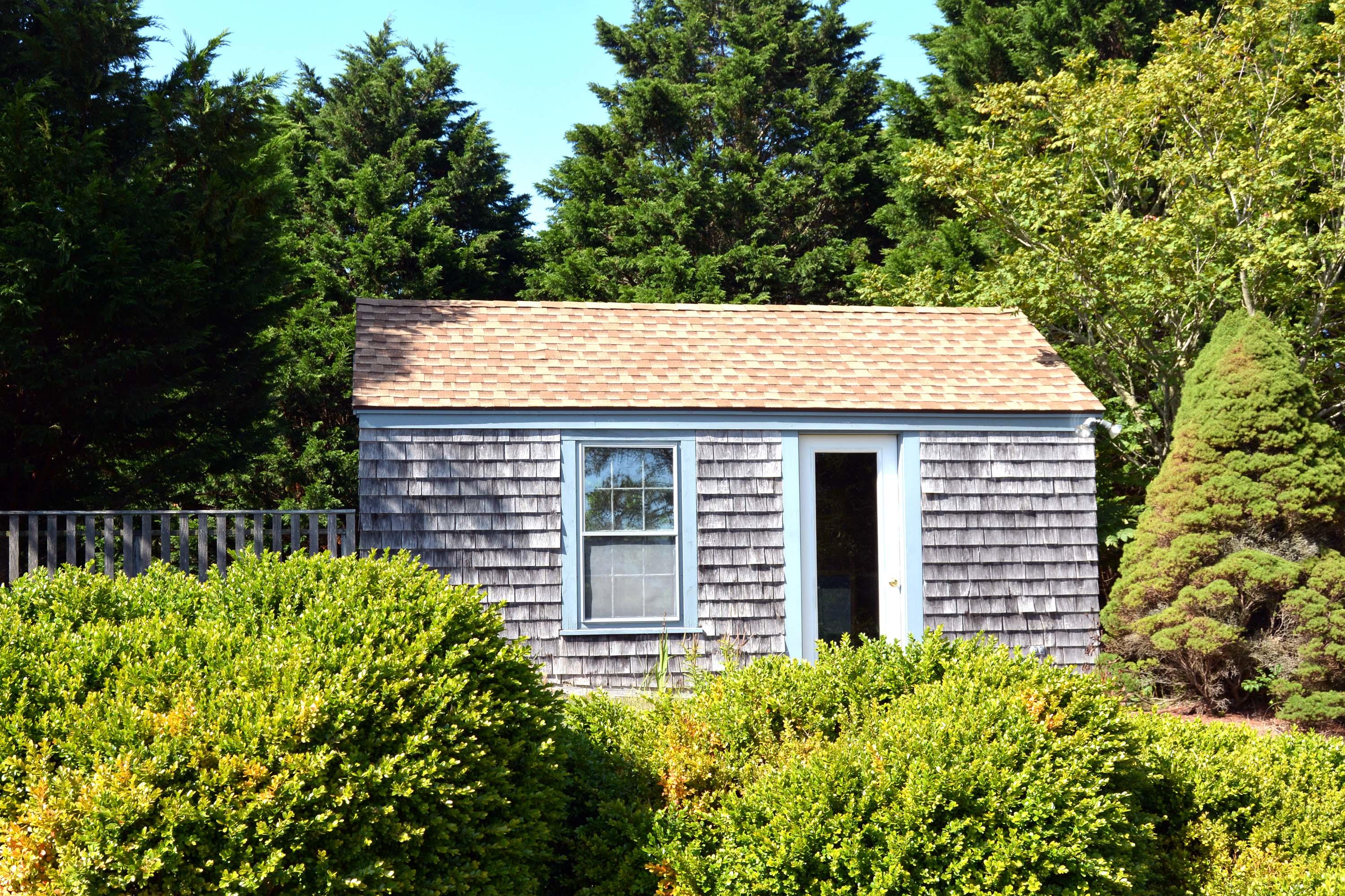 17 High Mark Road Chilmark, MA 02535 - Photo 43 of 52 a view of a house with a yard and potted plants
