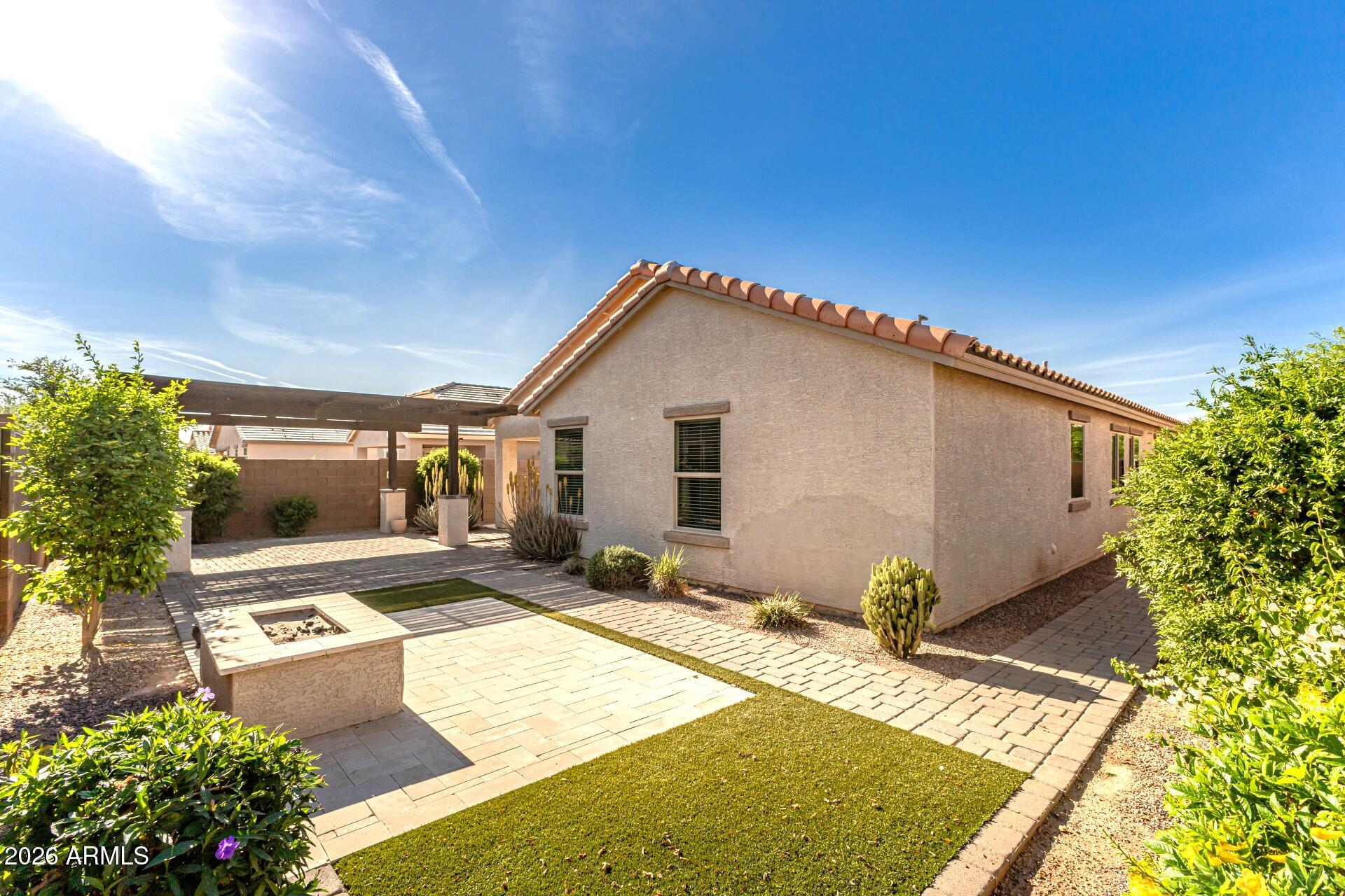 2177 East Gillcrest Road Gilbert, AZ 85298 - Photo 21 of 41 Turf & wood burning firepit
