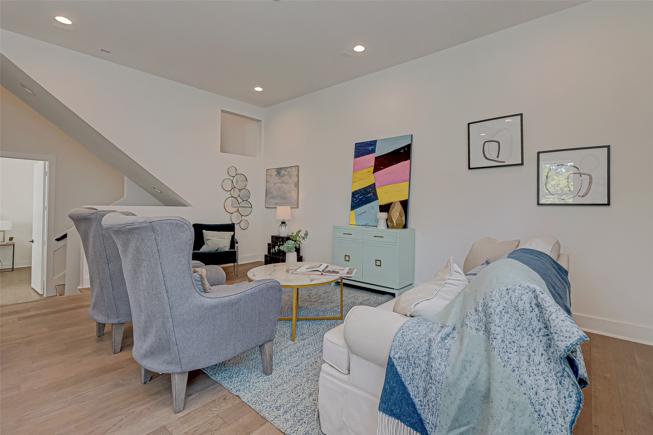 6129 West Montgomery Road Houston, TX 77091 - Photo 4 of 17 The second-floor living area invites you to unwind with stylish seating, designer touches, and a fresh color palette. A soft blend of modern comfort and vibrant personality anchors the space.