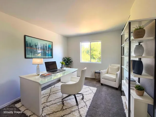 a workspace with furniture and window