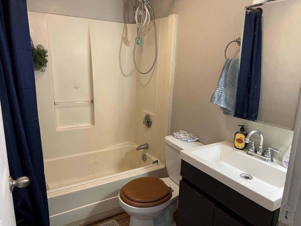 601 Main Street Bolton, MA 01740 - Photo 9 of 10 a bathroom with a sink toilet and shower