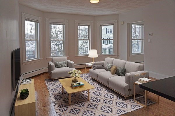 252 Ash Street, Unit 4 Waltham, MA 02453 - Photo 3 of 13 a living room with furniture rug and window