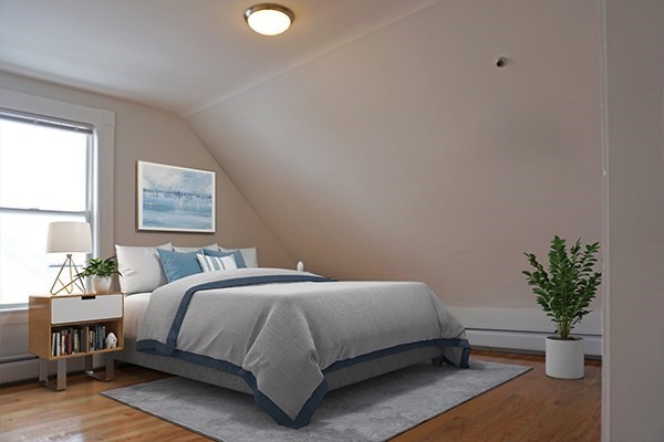 252 Ash Street, Unit 4 Waltham, MA 02453 - Photo 4 of 13 a bedroom with a bed lamp and window