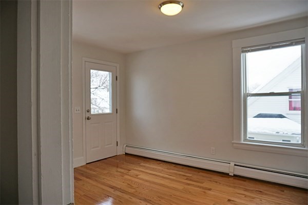 252 Ash Street, Unit 4 Waltham, MA 02453 - Photo 8 of 13 a view of empty room with window