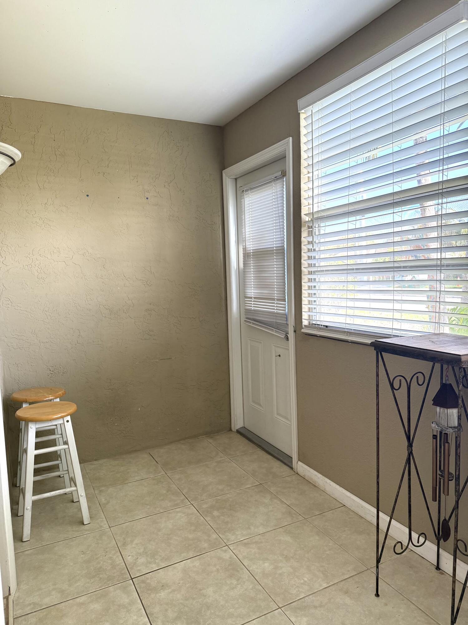 9272 Southwest 3rd Street, Unit 407 Boca Raton, FL 33428 - Photo 33 of 51 Inclosed Room - back door