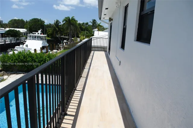 a bathroom with a sink mirror and tub