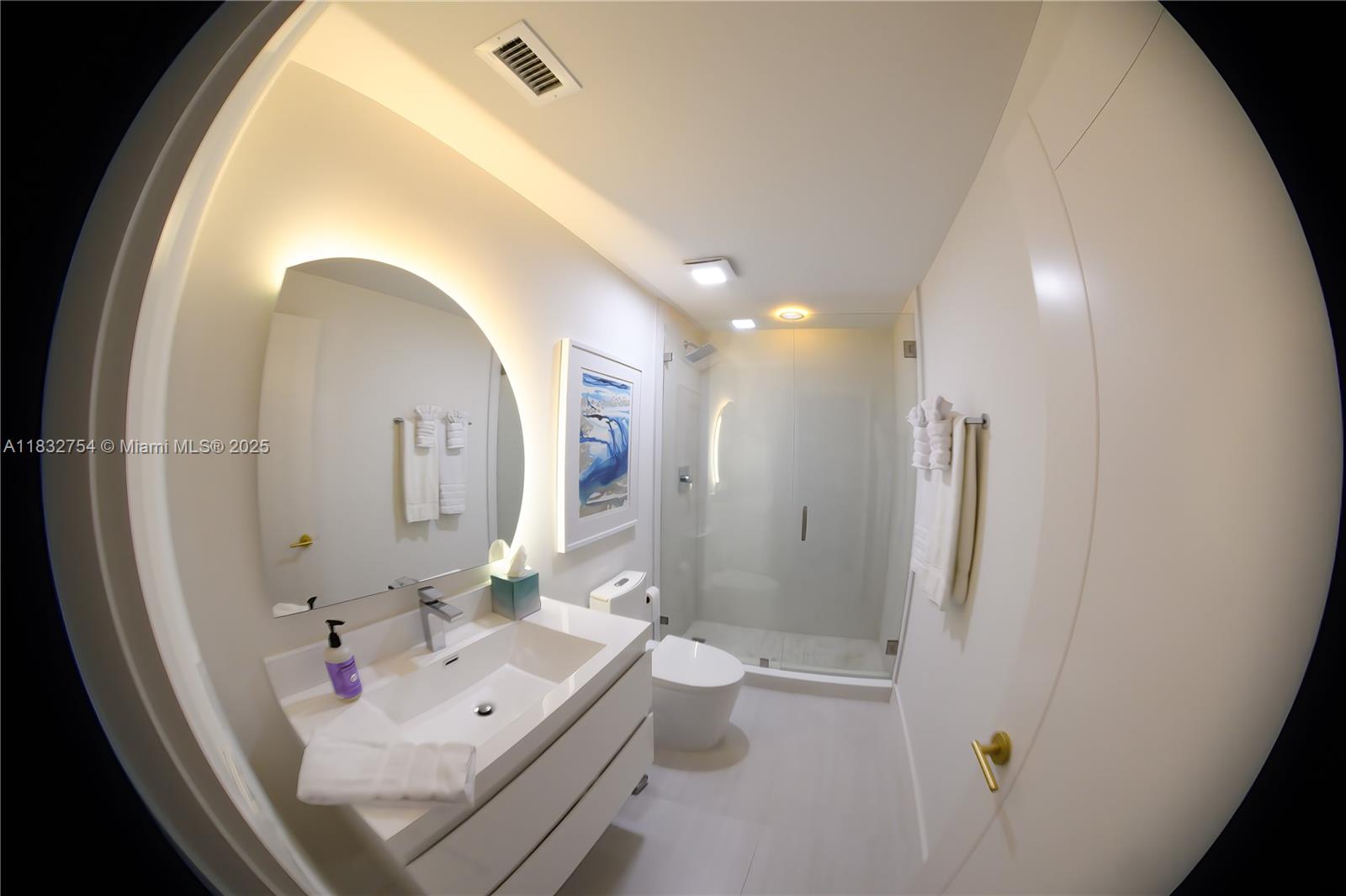 1240 Northeast 27th Terrace Pompano Beach, FL 33062 - Photo 22 of 98 a bathroom with a sink mirror and tub