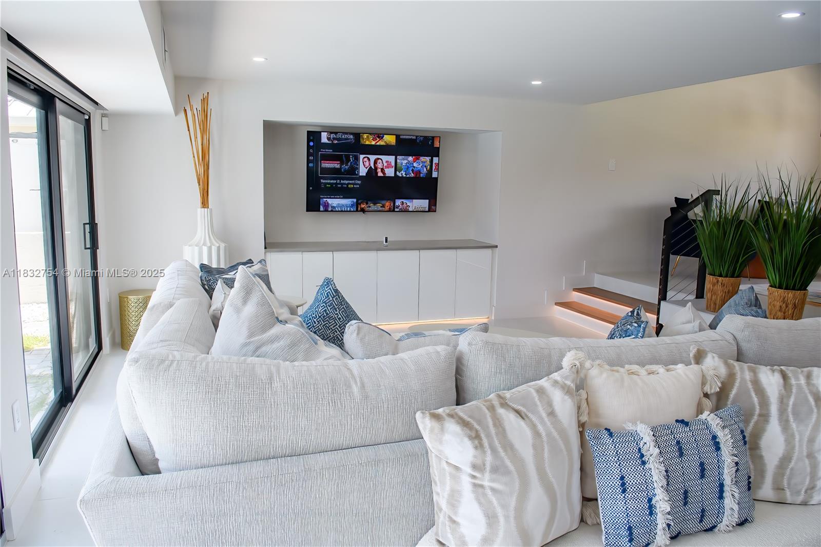 1240 Northeast 27th Terrace Pompano Beach, FL 33062 - Photo 3 of 98 a living room with furniture and a flat screen tv