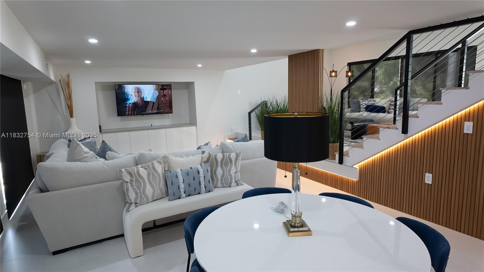 1240 Northeast 27th Terrace Pompano Beach, FL 33062 - Photo 39 of 98 a living room with furniture and a flat screen tv