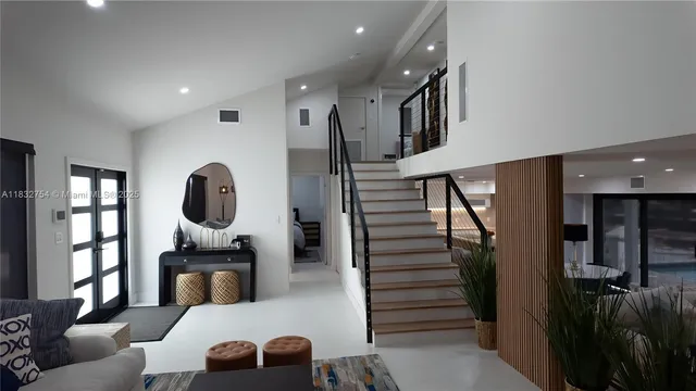 a view of a house with a yard and sitting area