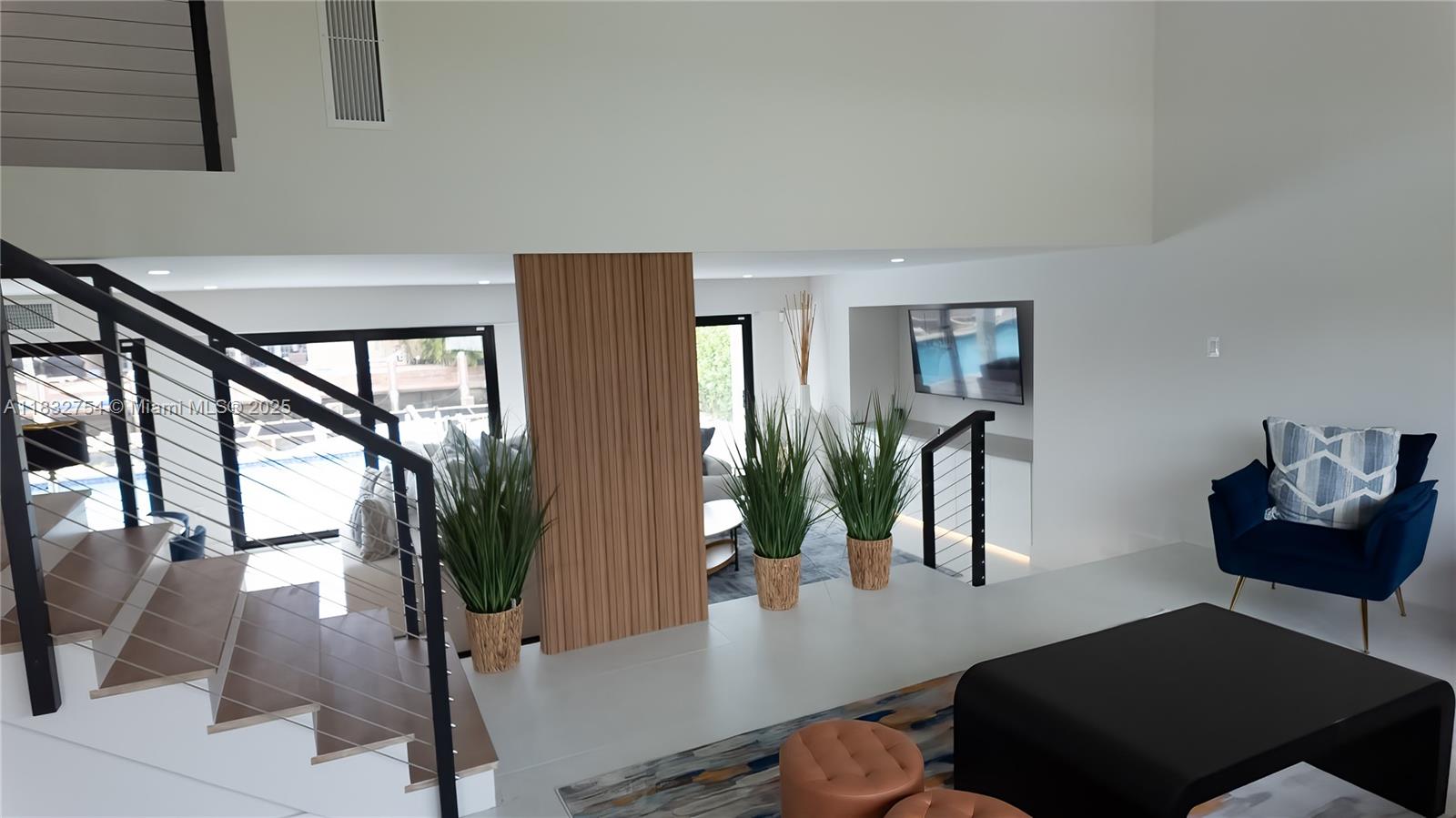 1240 Northeast 27th Terrace Pompano Beach, FL 33062 - Photo 73 of 98 a view of a livingroom with furniture and a potted plant