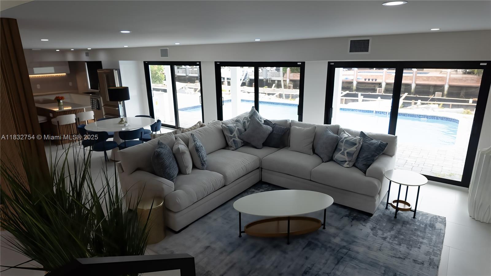 1240 Northeast 27th Terrace Pompano Beach, FL 33062 - Photo 78 of 98 a living room with furniture and a large window