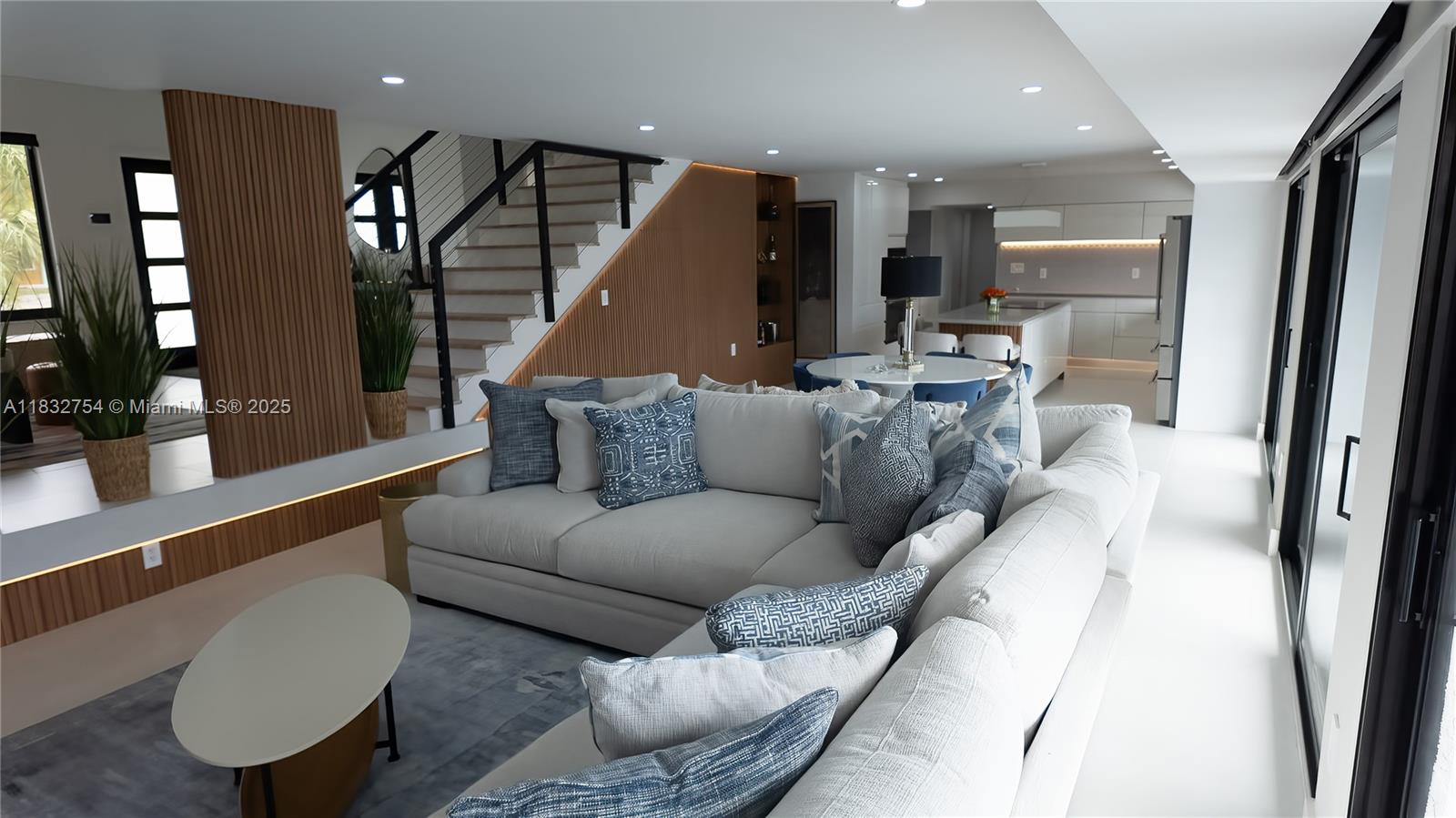 1240 Northeast 27th Terrace Pompano Beach, FL 33062 - Photo 81 of 98 a living room with furniture and a large mirror