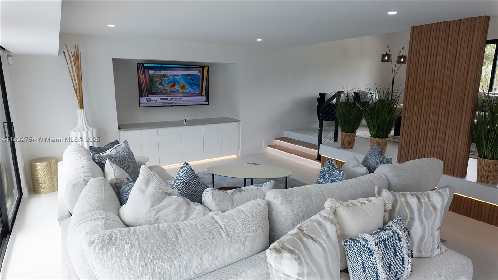 1240 Northeast 27th Terrace Pompano Beach, FL 33062 - Photo 82 of 98 a living room with furniture and a potted plant