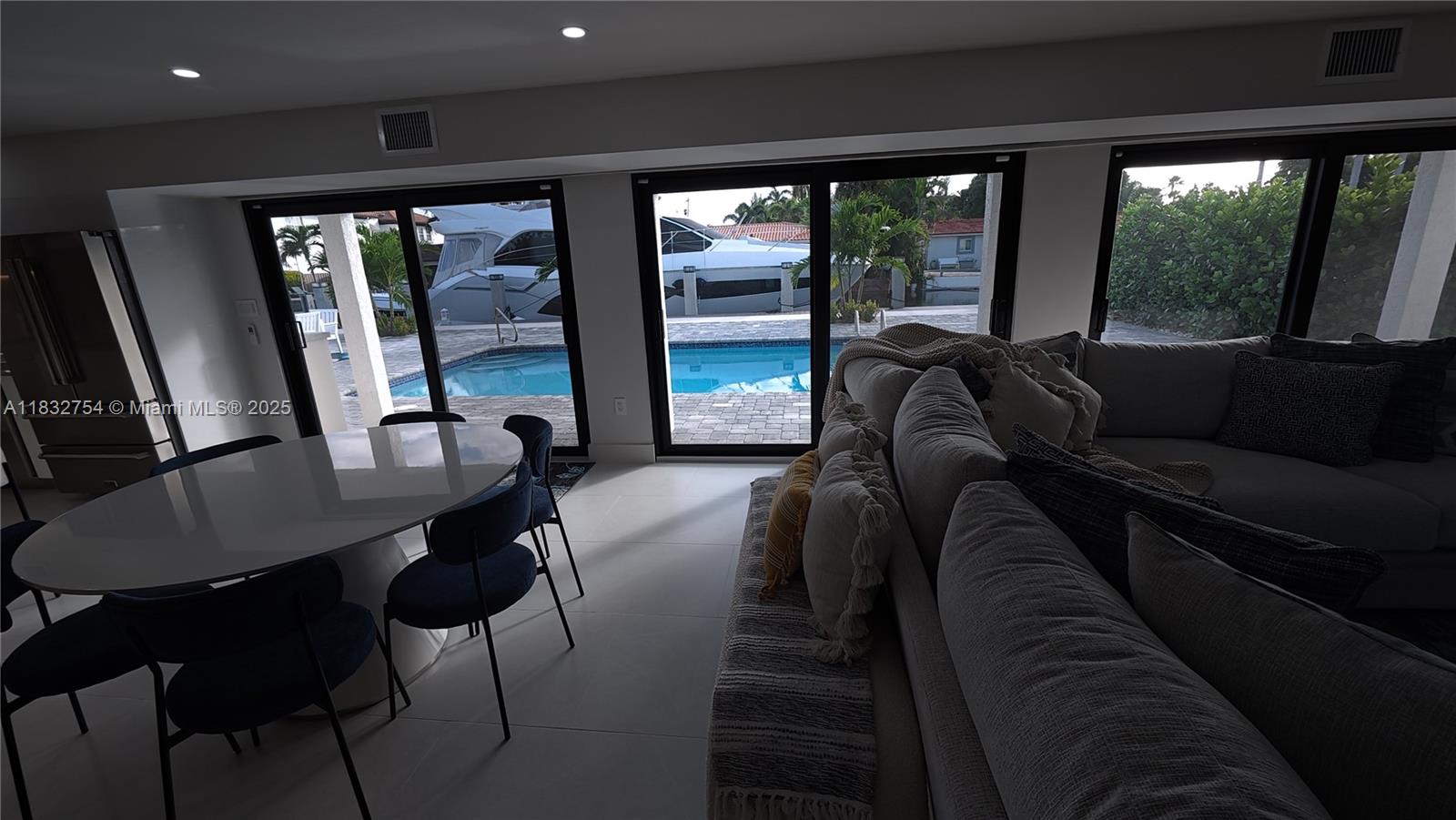 1240 Northeast 27th Terrace Pompano Beach, FL 33062 - Photo 94 of 98 a living room with furniture and a large window