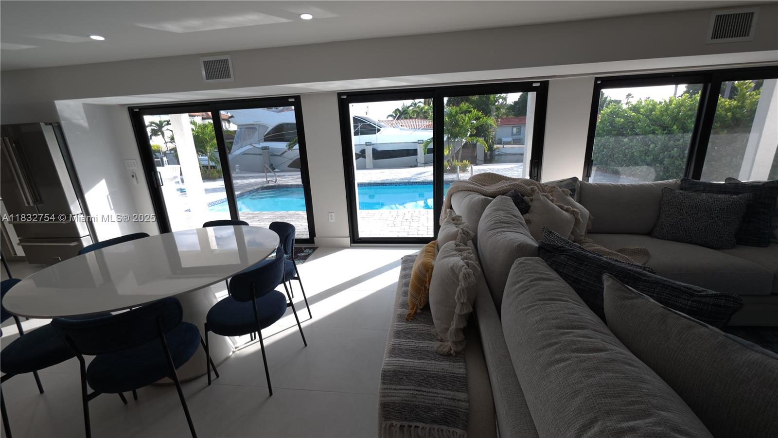 1240 Northeast 27th Terrace Pompano Beach, FL 33062 - Photo 95 of 98 a living room with furniture and a large window