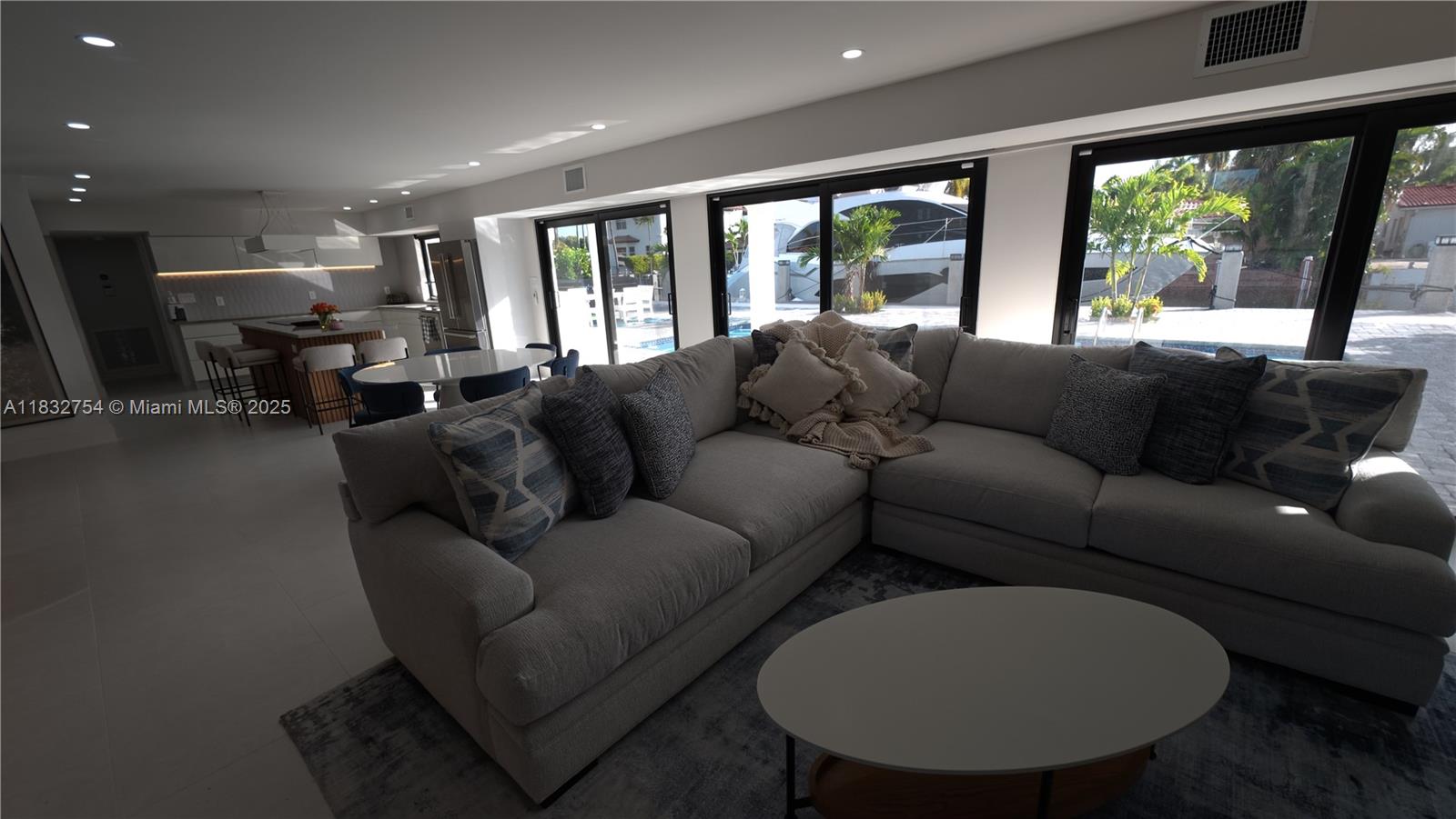1240 Northeast 27th Terrace Pompano Beach, FL 33062 - Photo 96 of 98 a living room with furniture and a large window