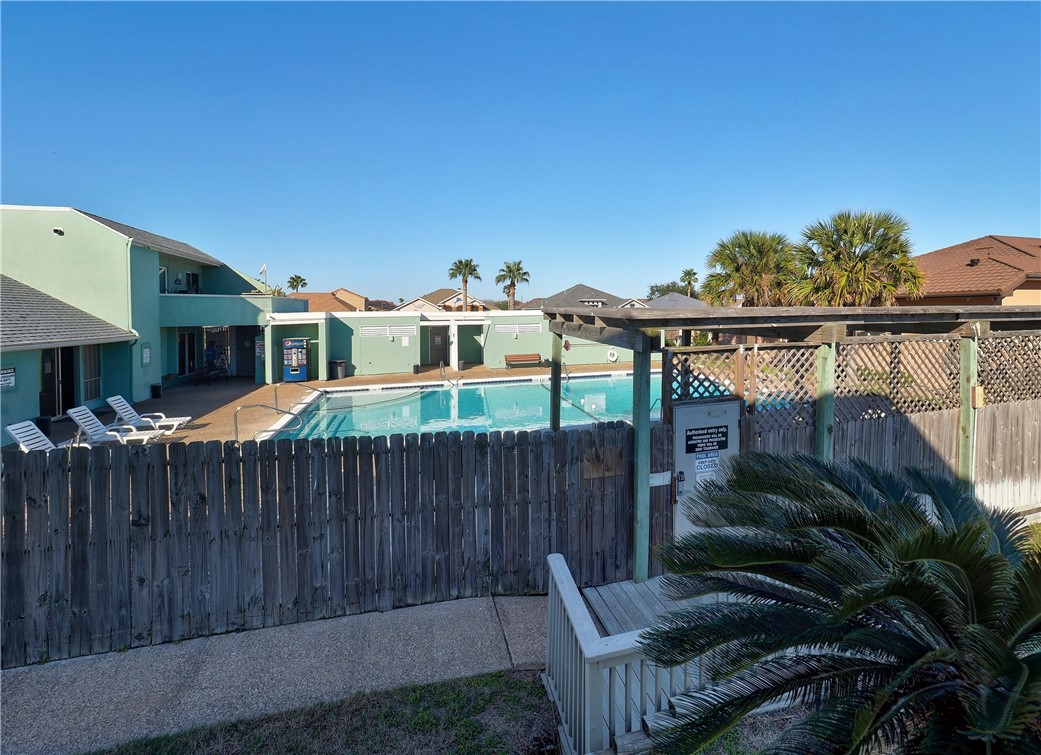 14300 Aloha Street, Unit 151 Corpus Christi, TX 78418 - Photo 18 of 33 a view of a house with wooden fence