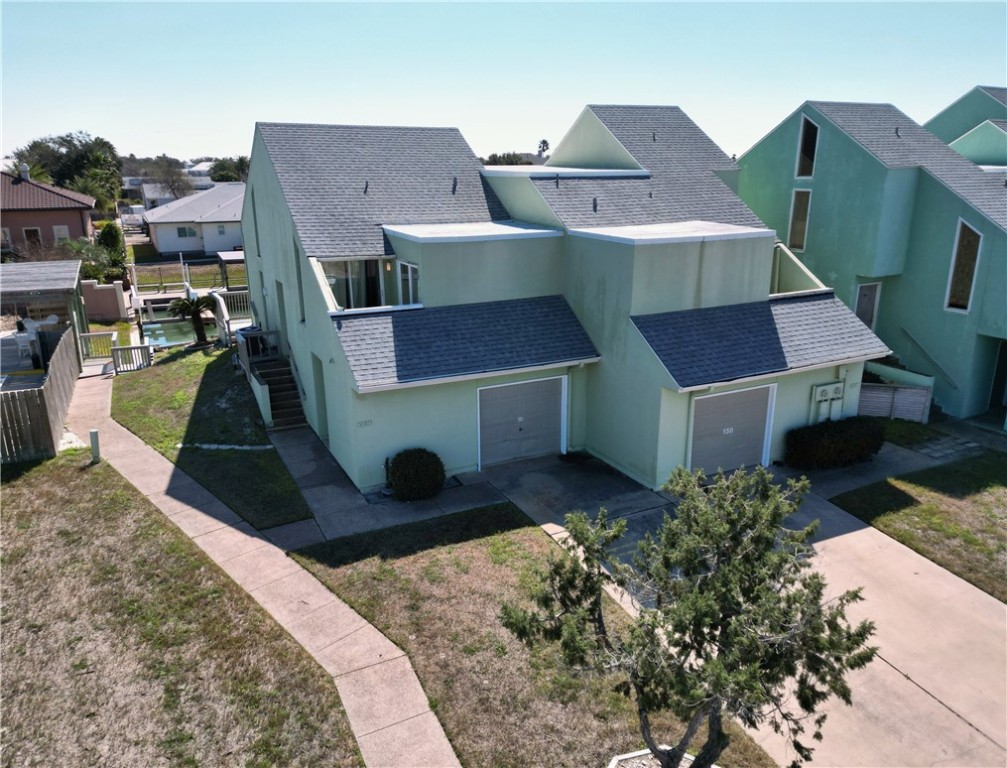 14300 Aloha Street, Unit 151 Corpus Christi, TX 78418 - Photo 3 of 33 a aerial view of a house with wooden fence