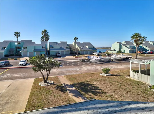 a view of multiple houses with outdoor space