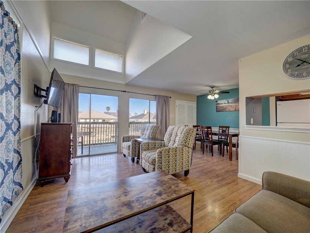 14300 Aloha Street, Unit 151 Corpus Christi, TX 78418 - Photo 5 of 33 a living room with furniture and a wooden floor