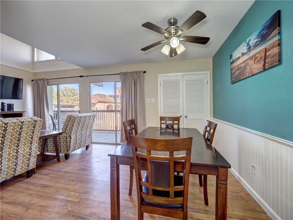 14300 Aloha Street, Unit 151 Corpus Christi, TX 78418 - Photo 10 of 33 a view of a dining room with furniture window and wooden floor
