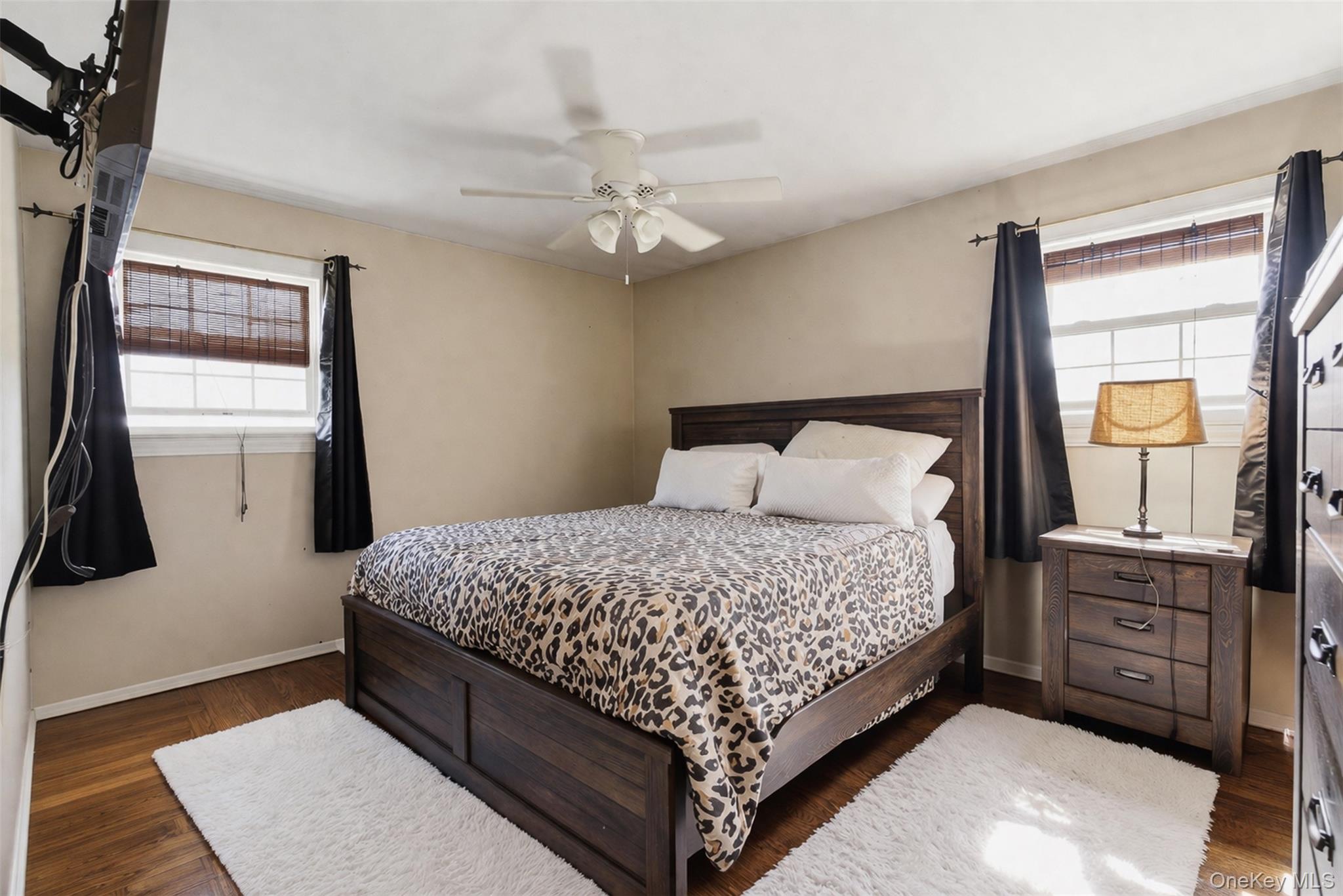 67 High Ridge Road Monroe, NY 10950 - Photo 13 of 34 a bedroom with a large bed and a chandelier